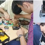دانش‌آموزان در حال کار بر روی یک پروژه رباتیک و الکترونیکی در محیط کلاس درس، با نصب و تجمیع قطعات رنگین و ماشین‌های رباتیکی.