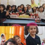 دانش‌آموزان دختری در حال جشن تولد کلاسی با کیک، شمع، بالون و تزئینات در کلاس درس