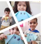 دانش‌آموزان کوچک در حال انجام فعالیت هنری و ساخت آرت‌کرافت‌های رنگی در کلاس درس