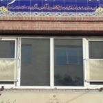 کاشی‌کاری و تابلوی سردر ورودی دبستان دخترانه والعصر