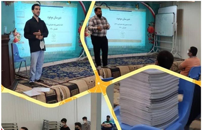 کلاسی با دانش‌آموزان جوان و دو معلم درحال سخنرانی جلوی پروجکتورهای دیجیتال
